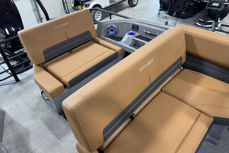 Slide: The Image of 2026 Sylvan G5 boat interior with tan seating and modern dashboard controls. - 14