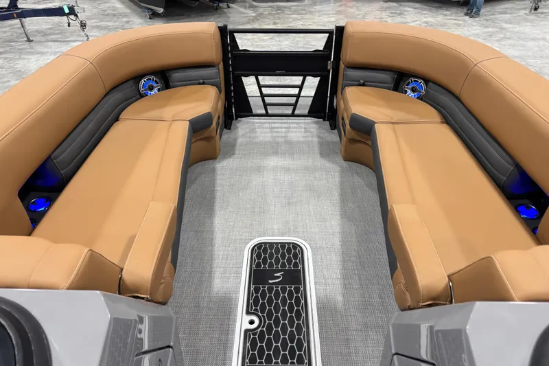 Slide: The Image of Luxurious interior of 2026 Sylvan G5 boat with tan seating and modern design. - 16