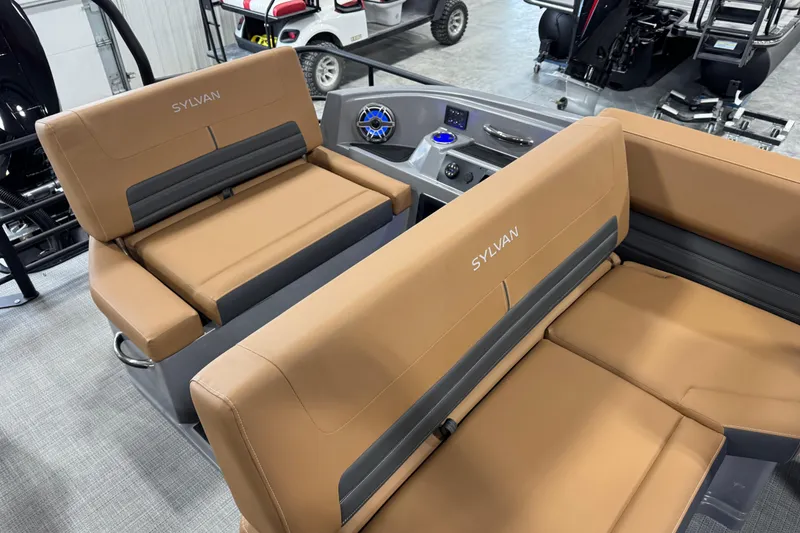 Slide: The Image of Luxurious seating in the 2026 Sylvan G5 boat, featuring tan upholstery and modern design. - 21