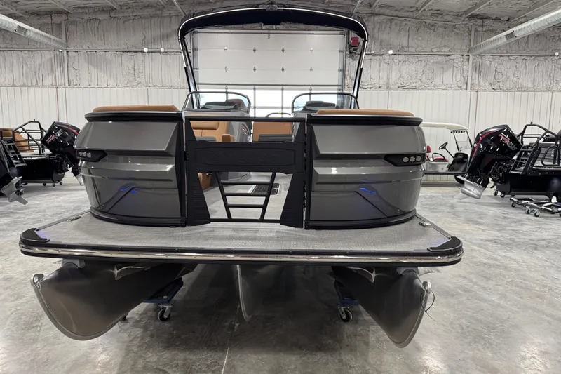 Slide: The Image of 2026 Sylvan G5 pontoon boat in a showroom, showcasing sleek design and modern features. - 5