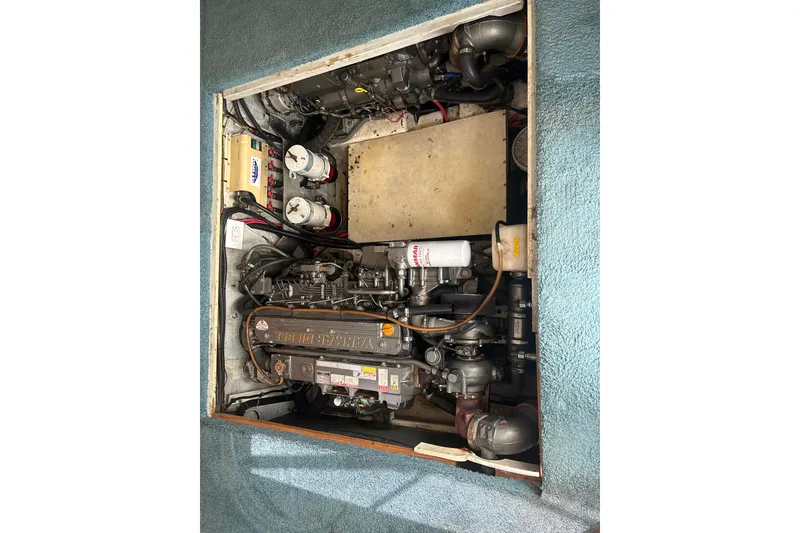 Slide: The Image of Engine compartment of a 1988 Ocean Yachts 35 Super Sport, showcasing mechanical components. - 14