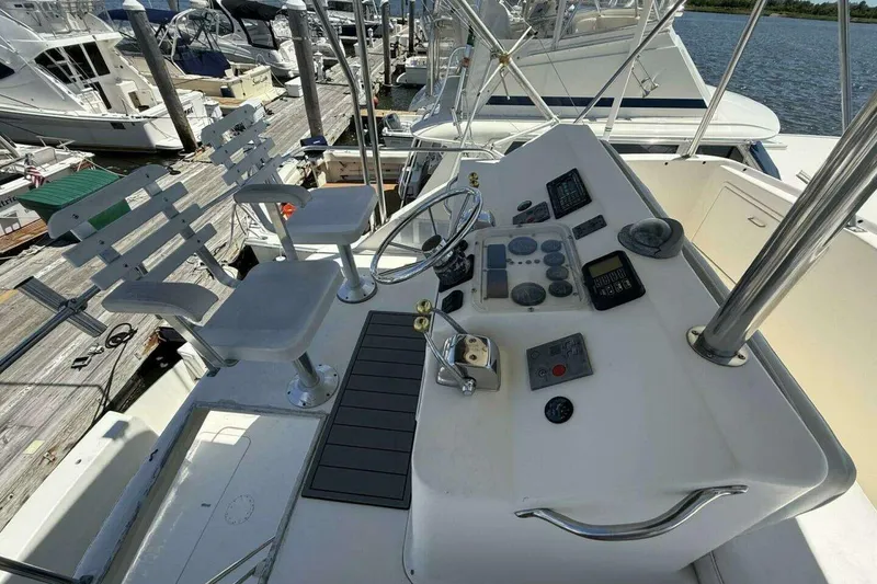 Slide: The Image of Cockpit of 1988 Ocean Yachts 35 Super Sport with steering wheel and control panel. - 5
