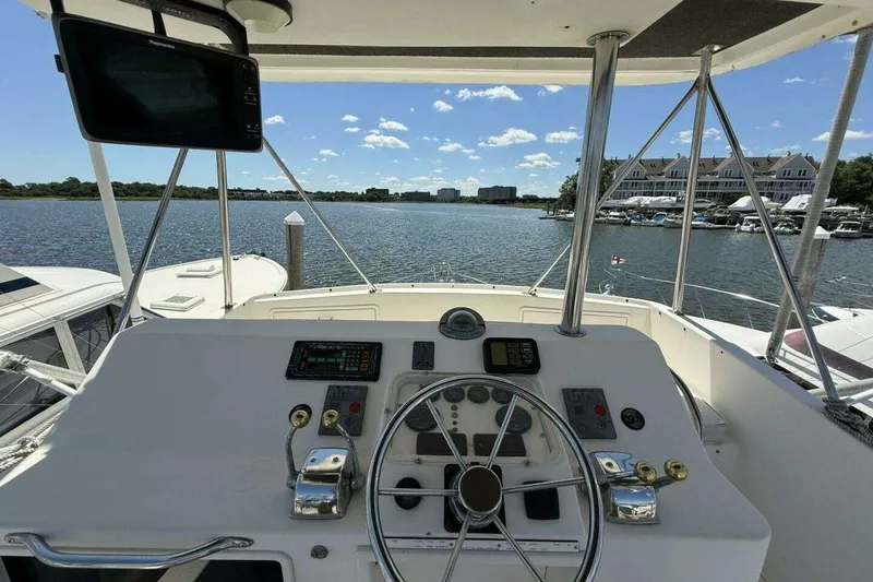 Slide: The Image of Cockpit view of 1988 Ocean Yachts 35 Super Sport, overlooking marina and waterway. - 6