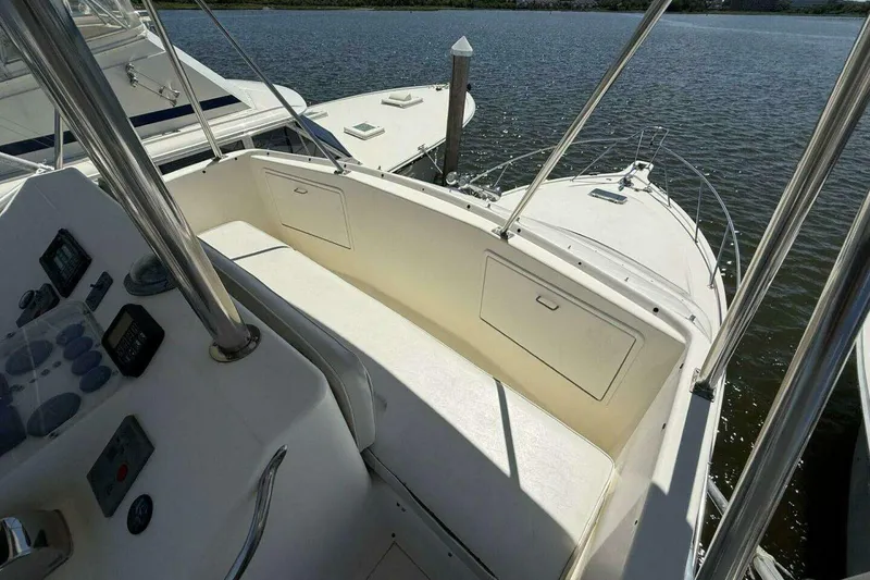 Slide: The Image of 1988 Ocean Yachts 35 Super Sport boat interior with control panel and seating area. - 7