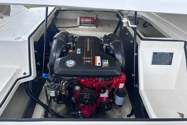 Slide: The Image of Engine compartment of a 2014 Regal 27 FasDeck boat, featuring a powerful V8 engine. - 11