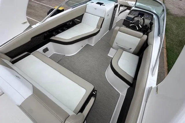 Slide: The Image of 2014 Regal 27 FasDeck boat interior with spacious seating and modern dashboard. - 16