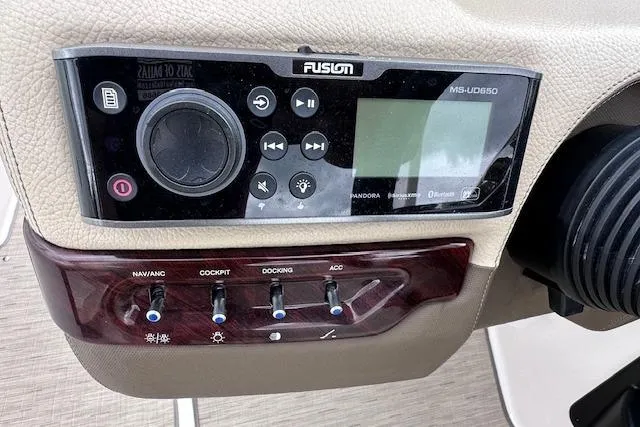 Slide: The Image of Control panel of a 2014 Regal 27 FasDeck boat with Fusion audio system. - 22