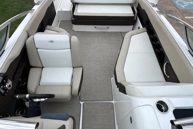 Slide: The Image of 2014 Regal 27 FasDeck boat interior with beige and white seating. - 25