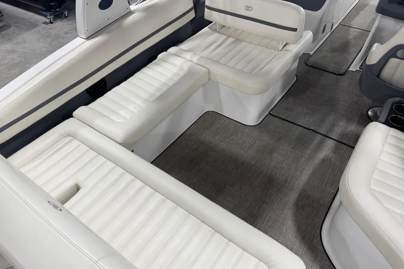 Slide: The Image of Interior of a 2016 Cobalt R7 boat with white leather seating. - 13