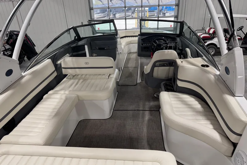 Slide: The Image of Interior of a 2016 Cobalt R7 boat with white seating and modern dashboard. - 14