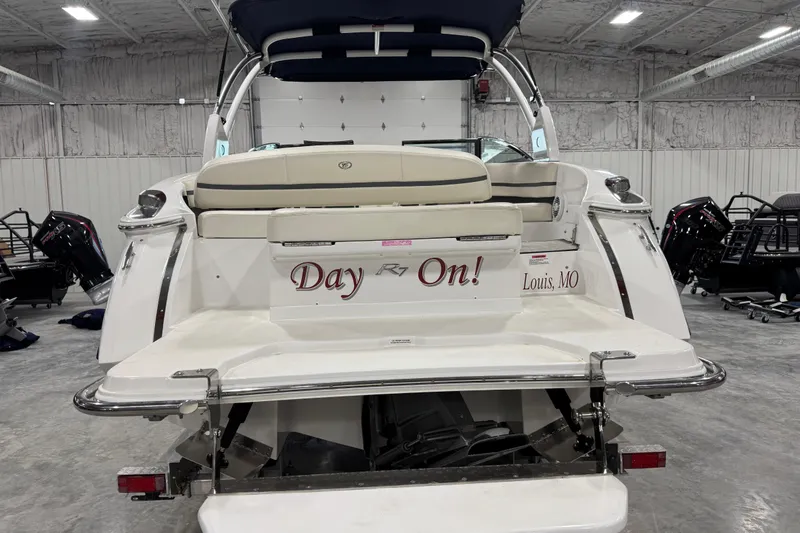 Slide: The Image of Rear view of a 2016 Cobalt R7 boat in a warehouse setting. - 5