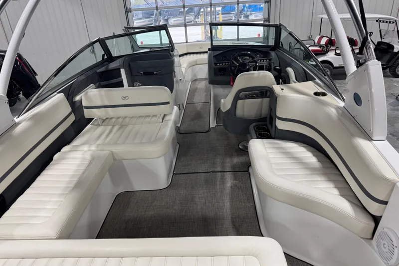 Slide: The Image of Interior of a 2016 Cobalt R7 boat with white seating and modern dashboard. - 6