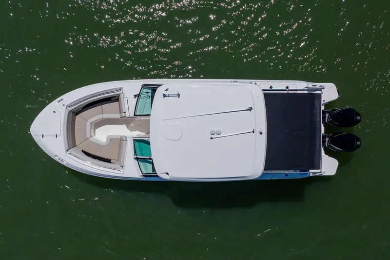 Slide: The Image of Aerial view of 2021 Boston Whaler 280 Vantage boat on green water. - 10