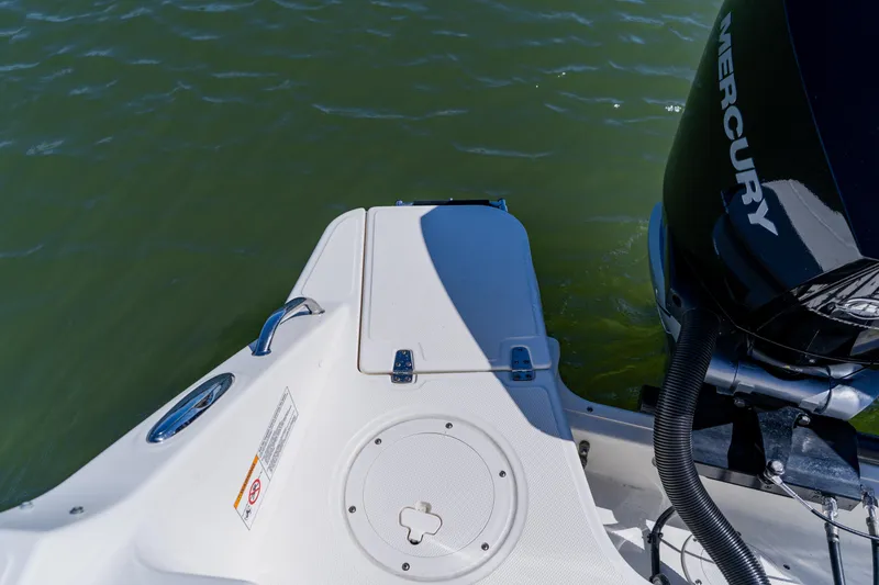 Slide: The Image of 2021 Boston Whaler 280 Vantage boat stern with Mercury engine on water. - 21