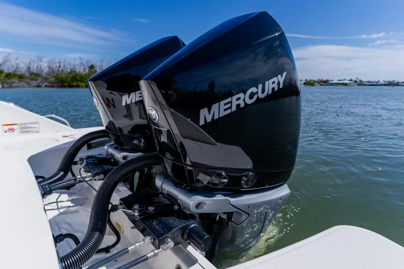 Slide: The Image of Twin Mercury outboard engines on a 2021 Boston Whaler 280 Vantage in scenic waters. - 22
