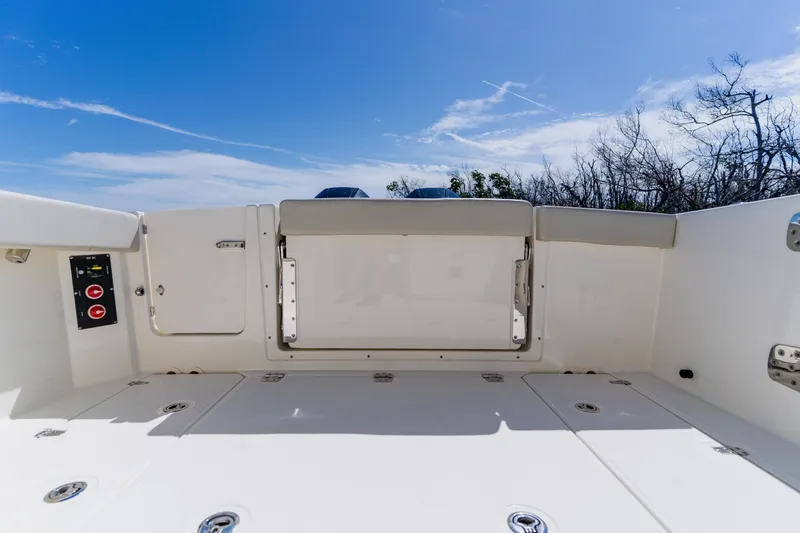 Slide: The Image of 2021 Boston Whaler 280 Vantage boat deck under clear blue sky. - 27