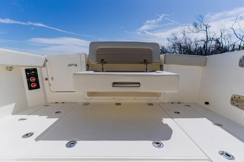 Slide: The Image of 2021 Boston Whaler 280 Vantage boat interior with seating and storage compartments. - 29