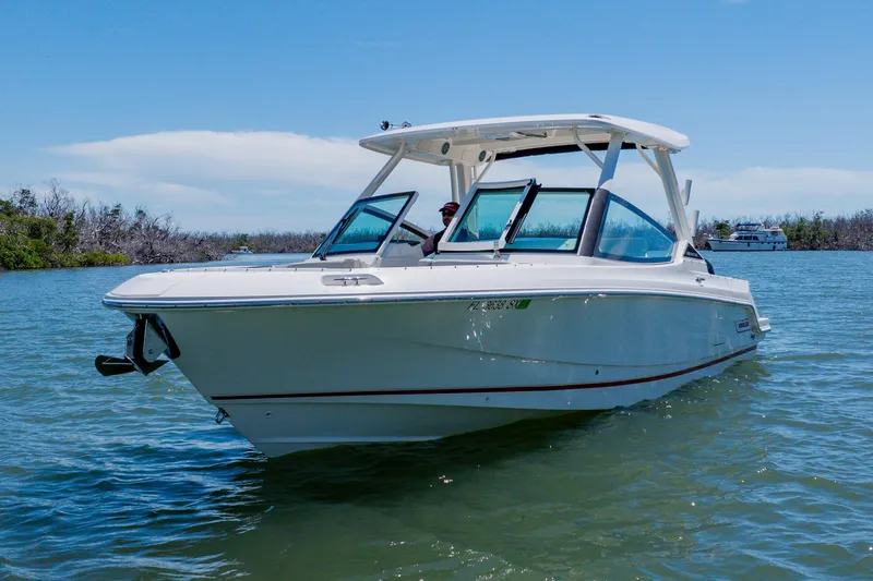 Slide: The Image of 2021 Boston Whaler 280 Vantage boat cruising on a sunny day in calm waters. - 3