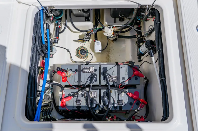 Slide: The Image of 2021 Boston Whaler 280 Vantage battery compartment with wiring and components. - 36