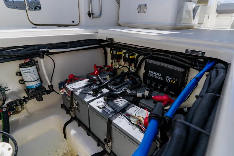Slide: The Image of Battery compartment of a 2021 Boston Whaler 280 Vantage with NOCO Genius charger. - 37