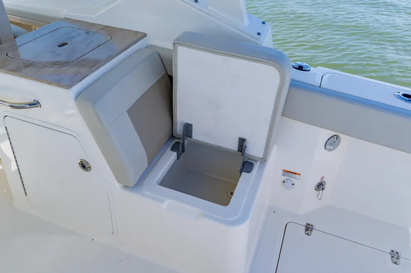 Slide: The Image of 2021 Boston Whaler 280 Vantage boat interior with open storage compartment. - 41
