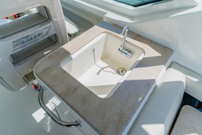 Slide: The Image of Boston Whaler 280 Vantage 2021 boat sink with faucet and countertop detail. - 42