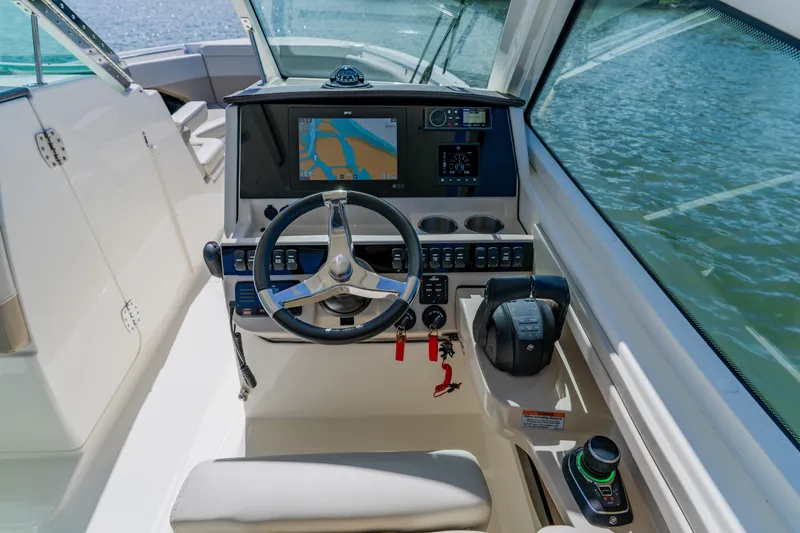 Slide: The Image of 2021 Boston Whaler 280 Vantage helm with navigation display and controls. - 46