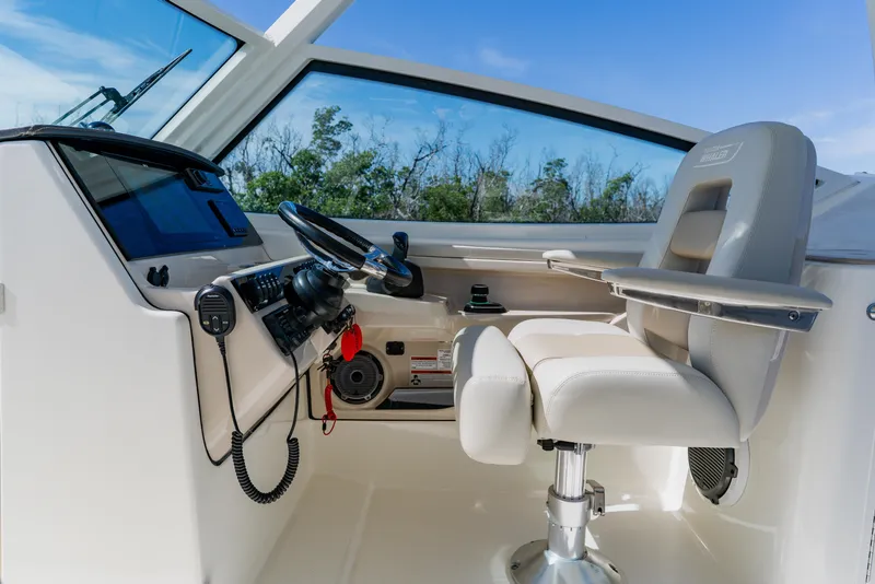 Slide: The Image of 2021 Boston Whaler 280 Vantage helm with modern controls and comfortable seating. - 47
