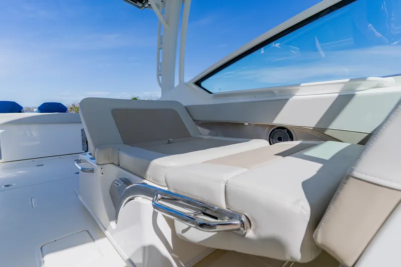 Slide: The Image of 2021 Boston Whaler 280 Vantage interior with luxurious seating and sleek design. - 59