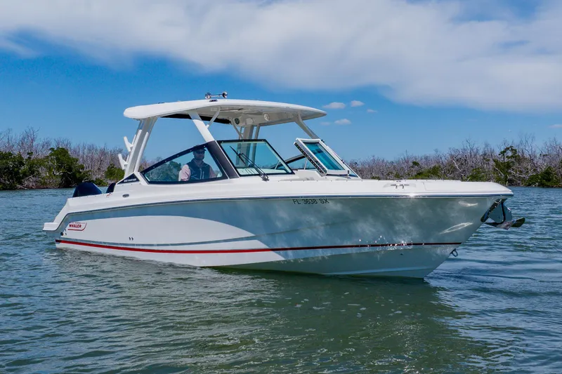 Slide: The Image of 2021 Boston Whaler 280 Vantage boat cruising on a sunny day. - 6