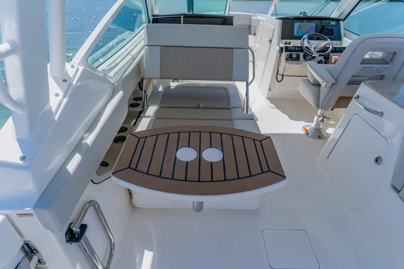 Slide: The Image of Interior of 2021 Boston Whaler 280 Vantage boat with seating and helm. - 64