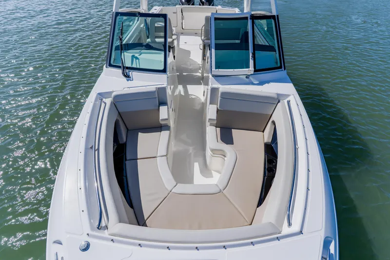 Slide: The Image of 2021 Boston Whaler 280 Vantage boat with spacious seating on calm water. - 71
