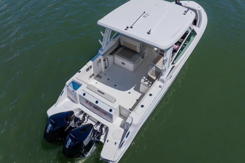 Slide: The Image of 2021 Boston Whaler 280 Vantage boat with dual engines on open water. - 9