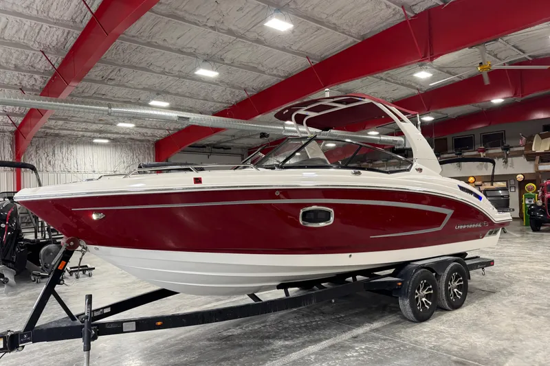 The Image of 2017 Chaparral 257 SSX boat in a showroom with red and white design. - 1
