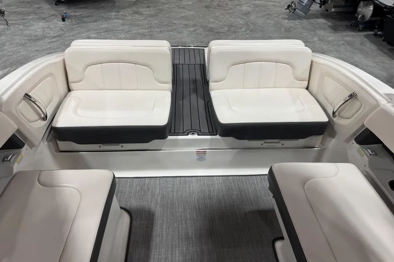 Slide: The Image of 2017 Chaparral 257 SSX boat interior with white seating and gray flooring. - 15