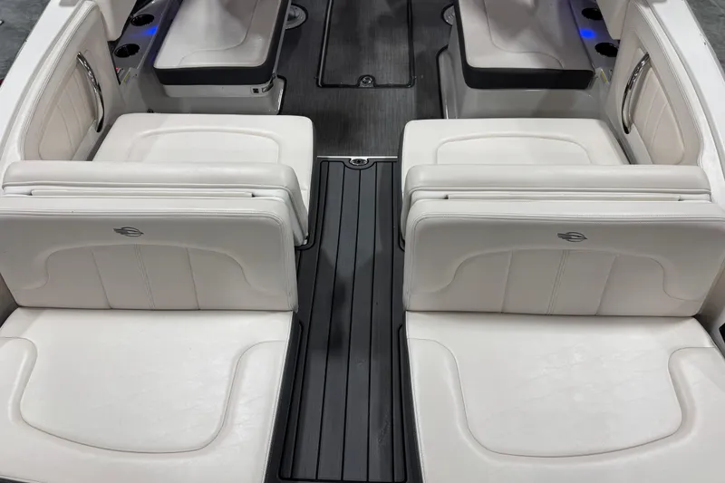 Slide: The Image of 2017 Chaparral 257 SSX boat interior with white leather seating and sleek design. - 7