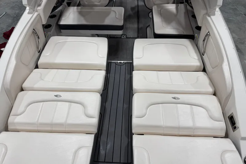 Slide: The Image of 2017 Chaparral 257 SSX boat interior with white cushioned seating and sleek design. - 8