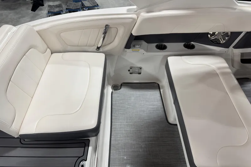 Slide: The Image of 2017 Chaparral 257 SSX boat interior with white seating and cup holders. - 9