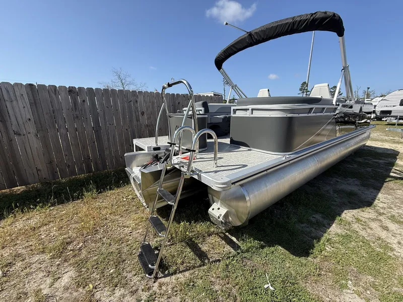 Slide: The Image of 2026 Avalon LSZ 25 Quad Lounger-Tritoon with ladder, parked on grass. - 6