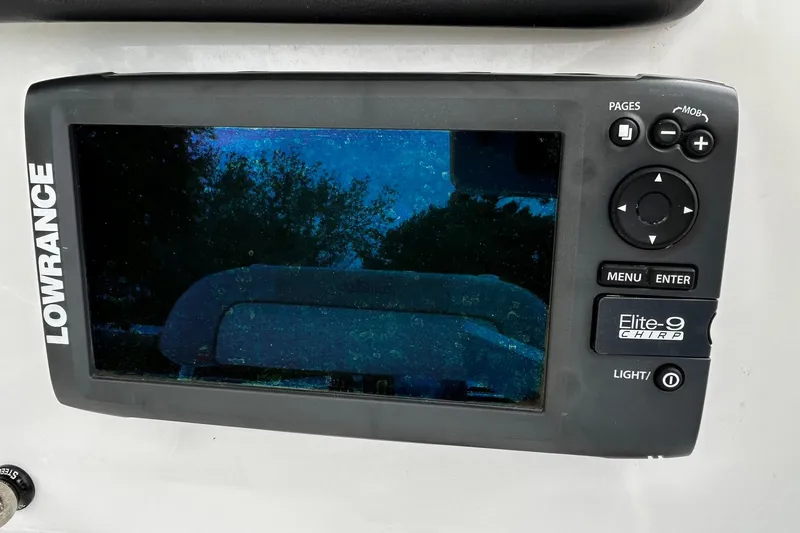 Slide: The Image of Lowrance Elite-9 CHIRP fishfinder on 2015 NauticStar 231 Coastal boat dashboard. - 10