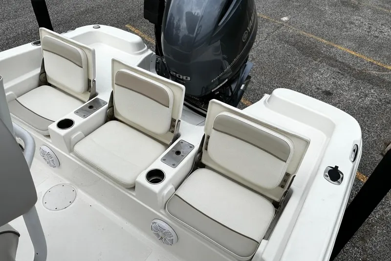 Slide: The Image of 2015 NauticStar 231 Coastal boat seats with cup holders and Yamaha engine. - 12