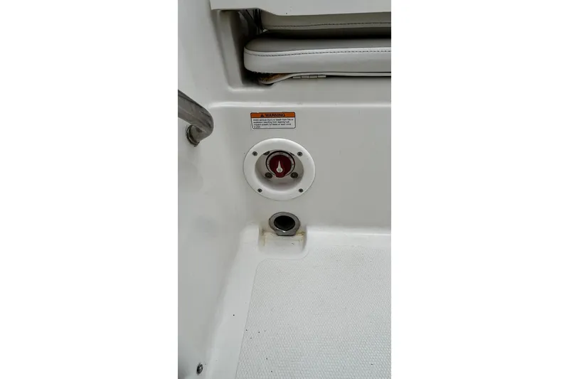 Slide: The Image of 2015 NauticStar 231 Coastal boat interior with control panel and seating. - 29