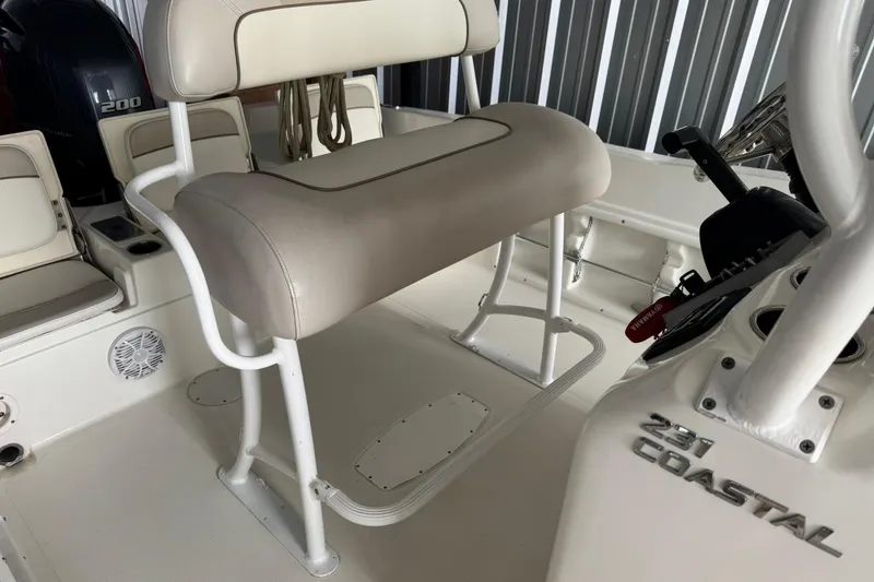 Slide: The Image of 2015 NauticStar 231 Coastal boat interior with seating and control panel. - 32