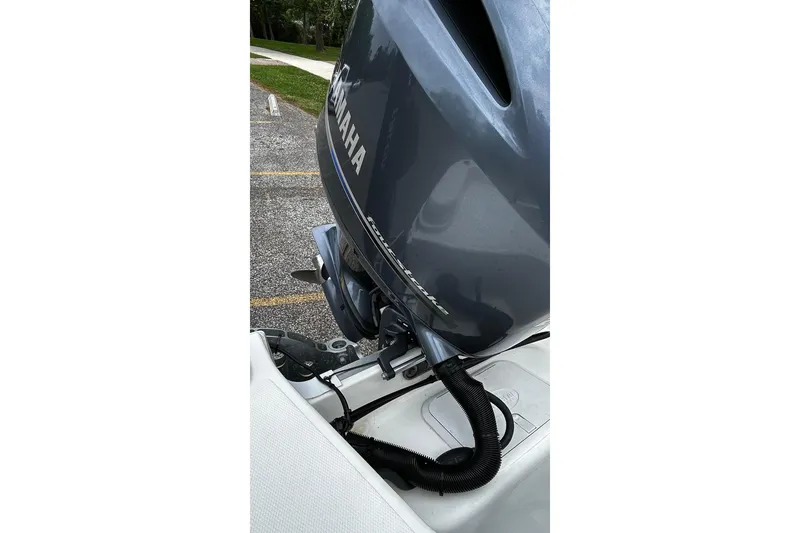 Slide: The Image of 2015 NauticStar 231 Coastal boat with Yamaha outboard motor in parking area. - 33