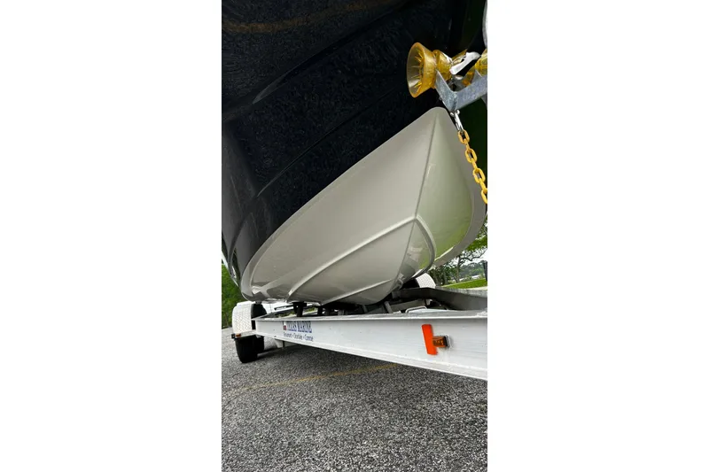 Slide: The Image of 2015 NauticStar 231 Coastal boat on trailer, showcasing hull design. - 5