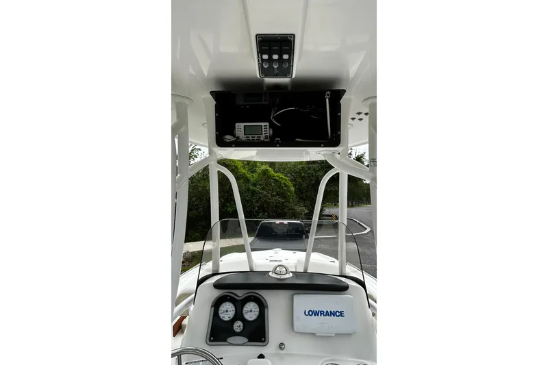 Slide: The Image of 2015 NauticStar 231 Coastal boat dashboard with Lowrance electronics and gauges. - 9