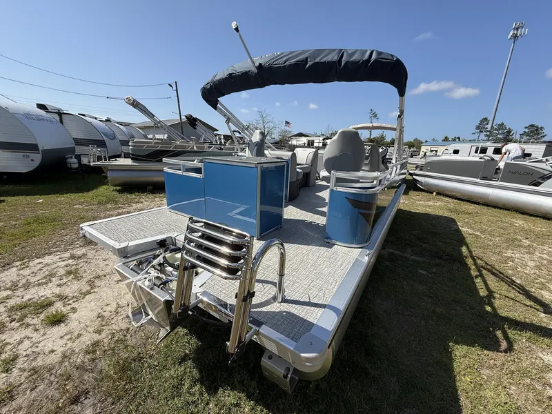 Slide: The Image of 2026 Avalon Venture 21 REAR FISH-90HP pontoon boat in a parking lot. - 3