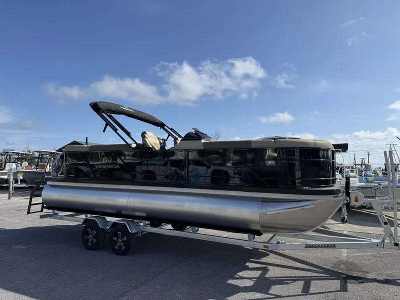 The Image of Veranda Relax Series 175HP-TRITOON 2026 on trailer under blue sky. - 1