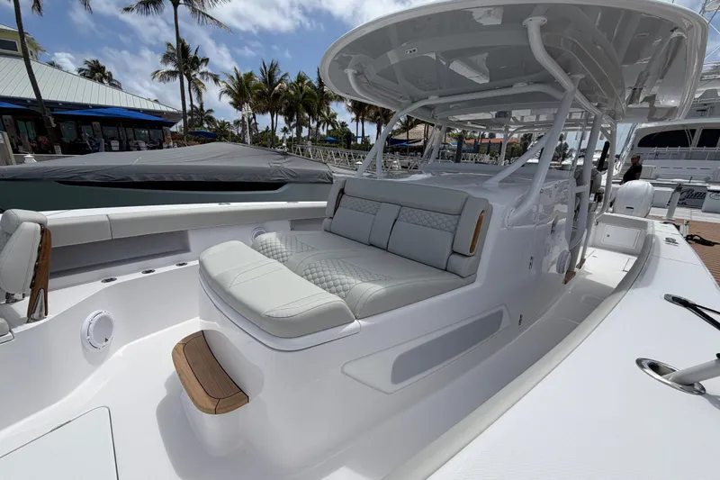 Slide: The Image of Luxurious seating on a 2026 Jupiter 43 boat docked at a marina. - 5