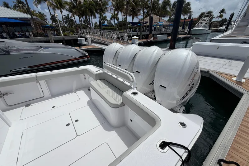 Slide: The Image of Luxury 2026 Jupiter 43 boat interior at marina, featuring sleek design and modern controls. - 8